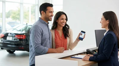 Customer showing a digital driver's license on a smartphone to a car rental agent.