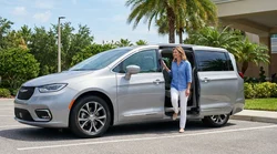 Senior woman stepping out of a spacious car rental parked on a sunny street in Florida