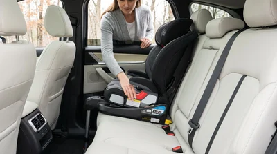 Child car seat with LATCH system securely installed in the back of a car hire in Pennsylvania