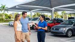 A customer talking to a service agent at a car rental counter in Miami