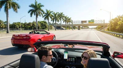 Person driving a car rental towards a toll plaza on a sunny Florida highway