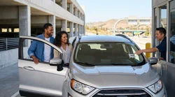 A modern car rental driving across the Bay Bridge towards the San Francisco skyline