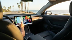 Close-up of a dashboard touchscreen displaying a map inside a car rental on a sunny California road