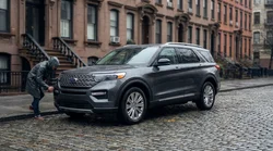 A shiny car rental parked on a New York street with a clear view of the windscreen and tyres