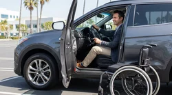Close-up of a driver using adaptive hand controls in a car rental on a bright street in Los Angeles