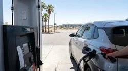 A fuel pump nozzle inserted into a car rental vehicle at a Las Vegas gas station