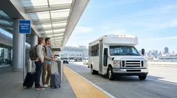 Passengers boarding a car hire shuttle bus at the San Francisco International Airport terminal