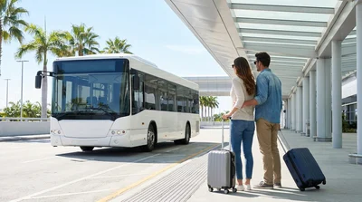 Travelers with luggage walking outside Las Vegas airport Terminal 1 towards a car hire shuttle