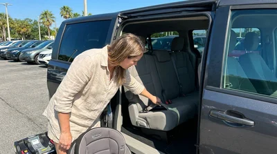 Empty back seat of an Orlando car rental showing the ISOFIX child seat anchor points