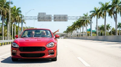 White car rental driving on a multi-lane Florida highway under a sunlit express lane sign