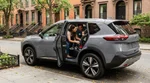 Child safety seat installed in the back of a car rental parked on a New York street