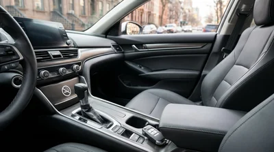 Spotless front seats and dashboard of a car rental parked on a New York street