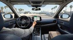 Smartphone showing a navigation map mounted on the dashboard of a car hire in Los Angeles