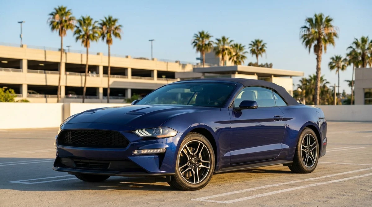 Modern car rental driving along a scenic coastal highway in California