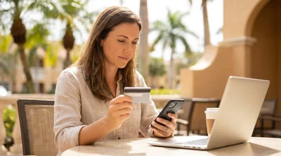 Close-up of a customer presenting a credit card at a Florida car rental desk