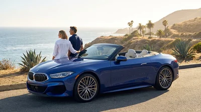 Modern car hire driving along a scenic sunny coastal highway in California