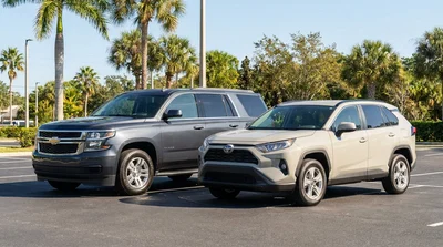 White SUV car rental driving along a scenic coastal highway lined with palm trees in Florida