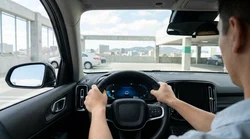Driver checking the dashboard fuel gauge inside a car rental parked on a San Francisco street