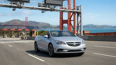 A modern car rental crossing the Golden Gate Bridge in San Francisco under a blue sky