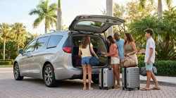 Five people loading luggage into the trunk of a large SUV car rental in Florida