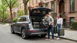 Family loading a pram and luggage into the trunk of an SUV car rental in New York