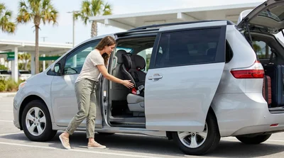 A child safety seat securely installed in the back of a car hire vehicle in Orlando