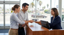 Close-up of a customer presenting a driver's license at a California car hire counter