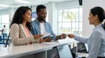 Smiling customer receiving keys from an agent at a car rental desk in Florida