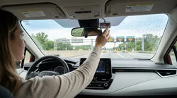 Close-up of an E-ZPass transponder mounted on the windshield of a car rental in Pennsylvania