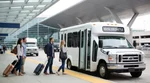 White car rental shuttle bus parked outside the passenger terminal at Philadelphia Airport in Pennsylvania