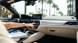 Close up of the steering wheel and leather front seats inside a car rental in California