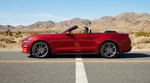 Couple driving a car rental along a scenic highway in California