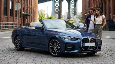 A row of modern vehicles available for car hire parked on a New York street