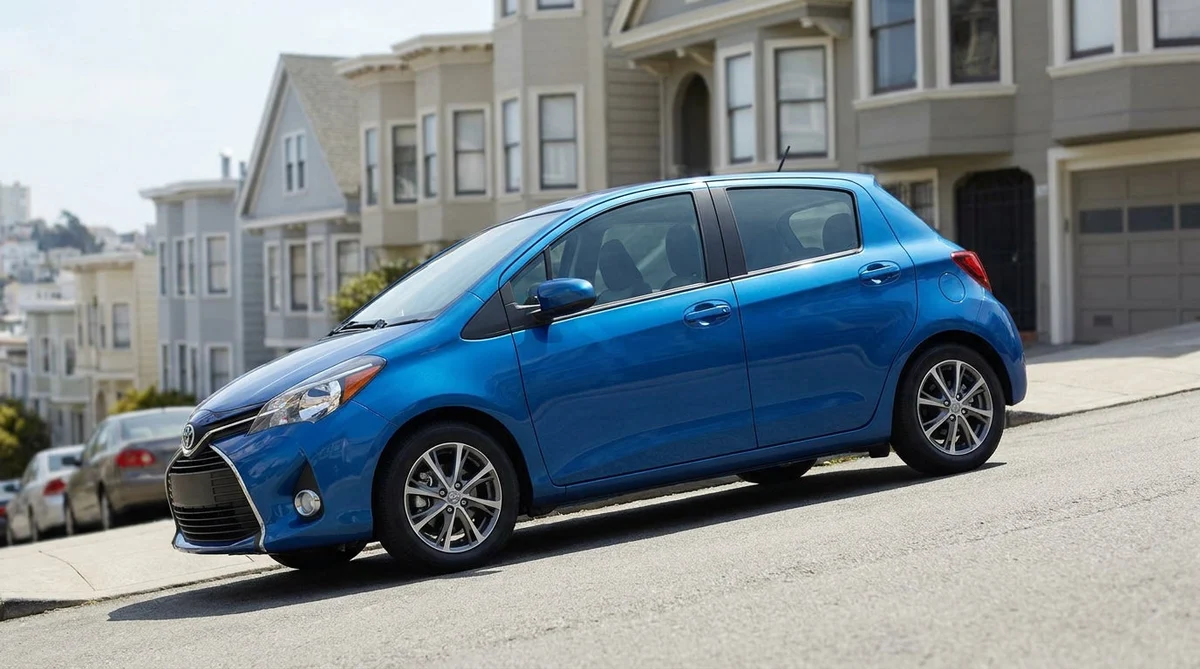 White compact car rental parked on a steep street in San Francisco