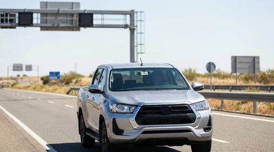 Close-up of a toll tag on the windshield of a car rental driving on a Texas highway