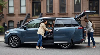 Passengers sitting inside a car rental driving on a New York street