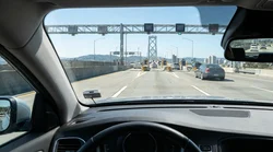Dashboard view from a car rental crossing the Golden Gate Bridge in San Francisco