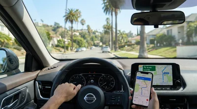 Dashboard view inside a car rental driving on a highway toward downtown Los Angeles