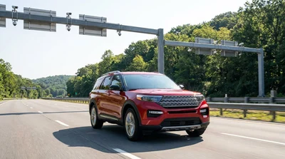 A car rental driving under a cashless toll gantry on a Pennsylvania highway