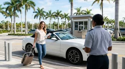 Customer receiving keys from an agent at a Miami car rental desk