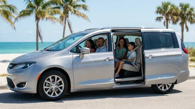 Friends smiling inside a car rental driving along a sunny highway surrounded by palm trees in Florida