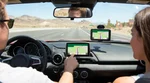 Illuminated dashboard GPS screen inside a car rental navigating the Las Vegas streets